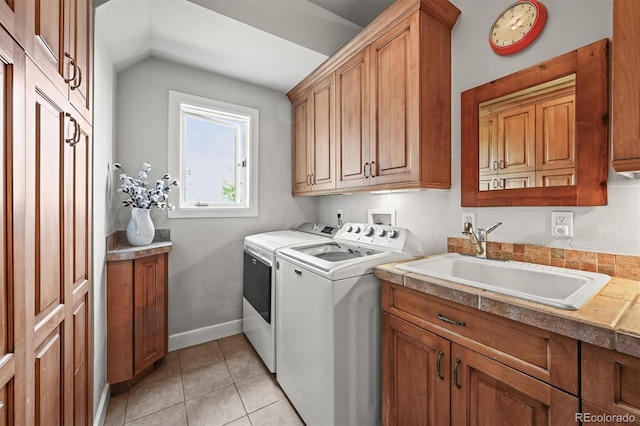 1425 Autumnwood Ln, Evergreen, CO 80439 - laundry room with cabinet space, washing machine and clothes dryer, and light tile patterned floors
