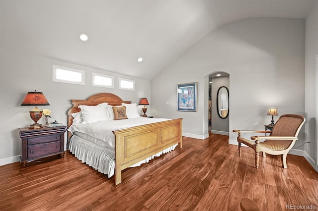 1425 Autumnwood Ln, Evergreen, CO 80439 - bedroom featuring lofted ceiling, arched walkways, wood finished floors, baseboards, and recessed lighting