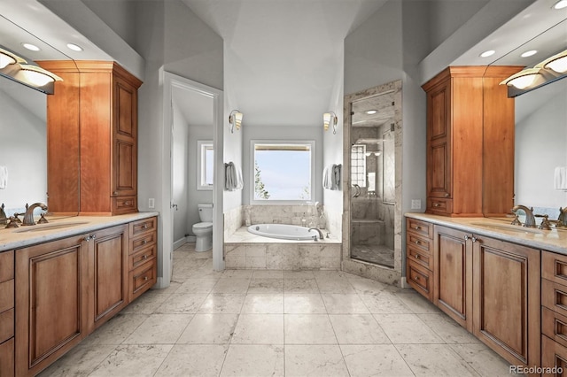 1425 Autumnwood Ln, Evergreen, CO 80439 - full bathroom with a shower stall, toilet, a garden tub, two vanities, and recessed lighting