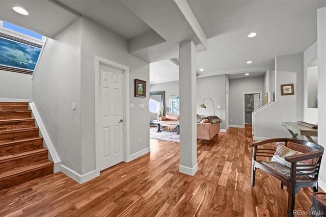 1425 Autumnwood Ln, Evergreen, CO 80439 - foyer entrance with wood finished floors, stairs, baseboards, and recessed lighting
