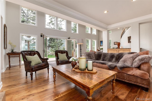 1425 Autumnwood Ln, Evergreen, CO 80439 - living area featuring recessed lighting, ornamental molding, light wood-style flooring, and a high ceiling