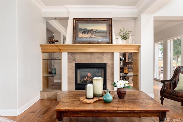 1425 Autumnwood Ln, Evergreen, CO 80439 - living room with wood finished floors, crown molding, and a tile fireplace