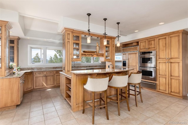 1425 Autumnwood Ln, Evergreen, CO 80439 - kitchen with open shelves, double oven, light stone counters, a warming drawer, and light tile patterned floors
