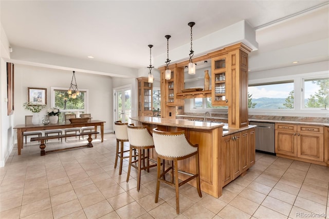 1425 Autumnwood Ln, Evergreen, CO 80439 - kitchen with stainless steel dishwasher, plenty of natural light, light tile patterned floors, and recessed lighting
