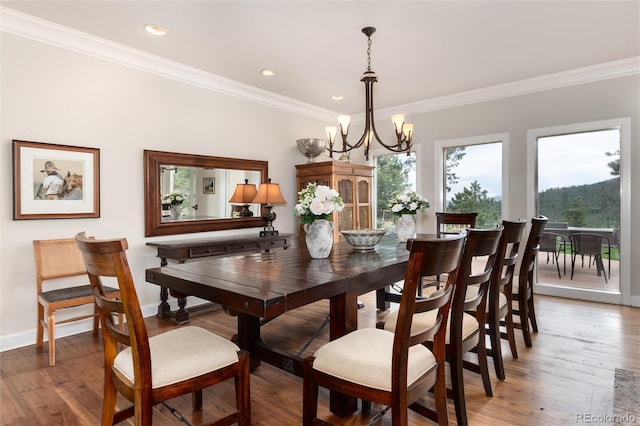 1425 Autumnwood Ln, Evergreen, CO 80439 - dining area with a chandelier, ornamental molding, light wood-type flooring, and recessed lighting