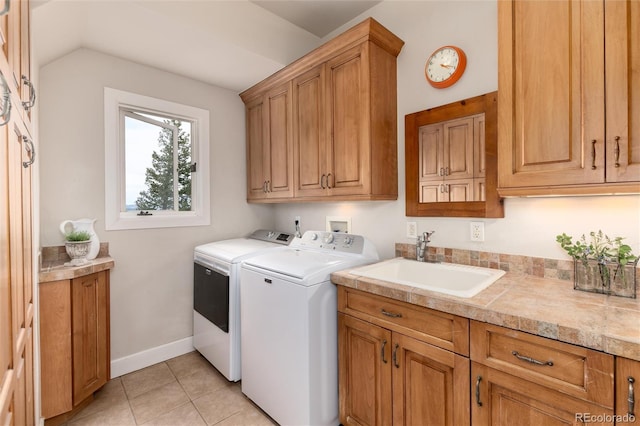 1425 Autumnwood Ln, Evergreen, CO 80439 - laundry area featuring cabinet space, washer and clothes dryer, and light tile patterned floors