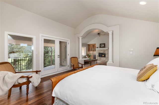 1425 Autumnwood Ln, Evergreen, CO 80439 - bedroom featuring ornate columns, access to exterior, lofted ceiling, wood finished floors, and multiple windows