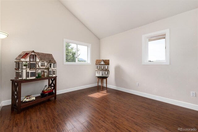 1425 Autumnwood Ln, Evergreen, CO 80439 - unfurnished room with wood finished floors and high vaulted ceiling