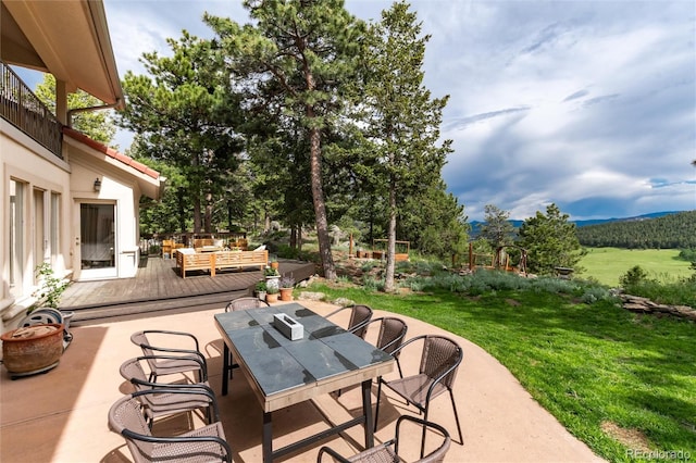 1425 Autumnwood Ln, Evergreen, CO 80439 - view of patio / terrace featuring outdoor dining space and an outdoor hangout area