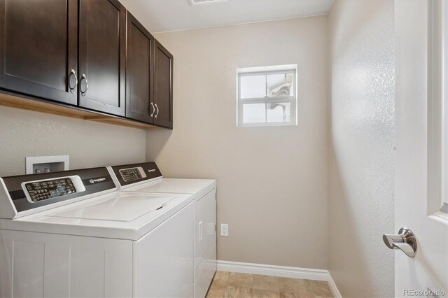9528 Pendio Ct, Highlands Ranch, CO 80126 - laundry room featuring washing machine and dryer, cabinet space, and baseboards