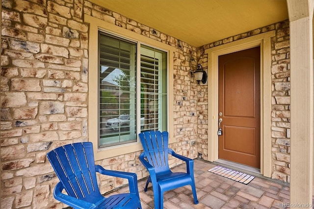9528 Pendio Ct, Highlands Ranch, CO 80126 - property entrance featuring stone siding and a porch