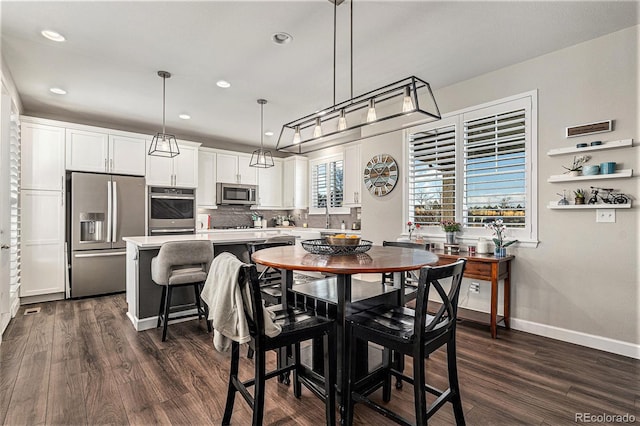 dining room with dark wood-type flooring