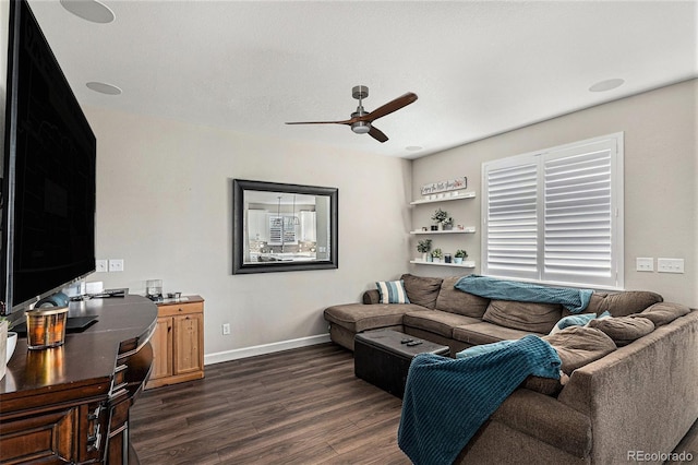 living room featuring dark hardwood / wood-style floors and ceiling fan