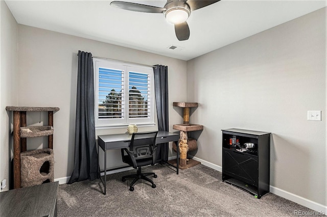 carpeted home office with ceiling fan