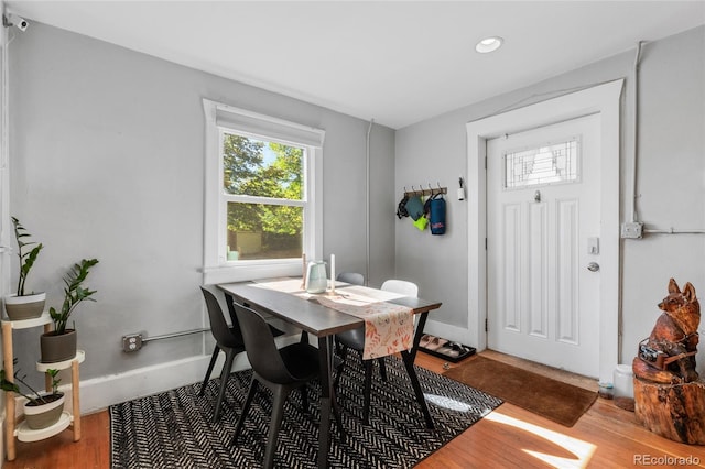 dining space featuring wood-type flooring