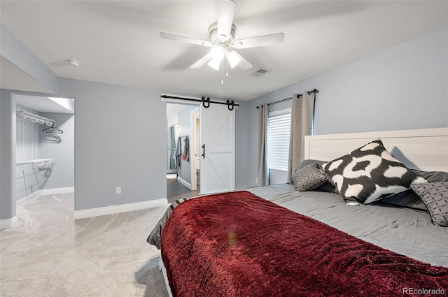 2209 Lupine Pl, Erie, CO 80516 - bedroom featuring carpet flooring, a barn door, and ceiling fan