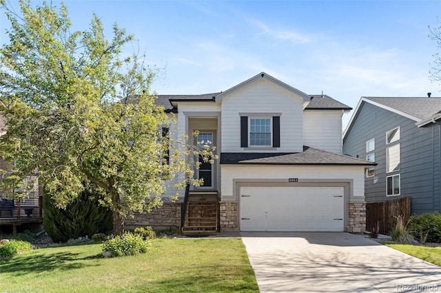 8864 S Field Ct, Littleton, CO 80128 - view of front of home featuring stone siding, a garage, driveway, and roof with shingles