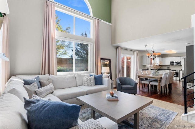 8864 S Field Ct, Littleton, CO 80128 - living room featuring a high ceiling and a chandelier