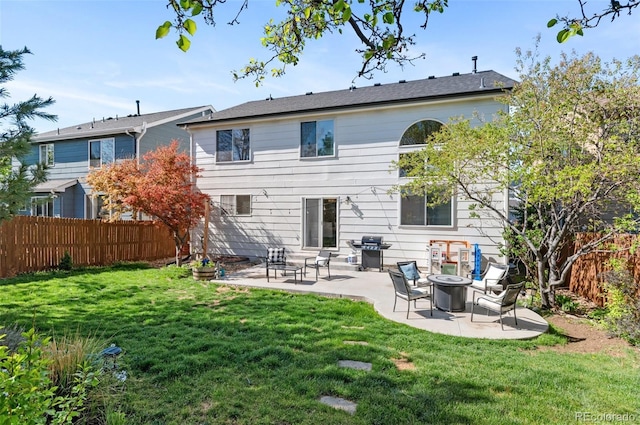 8864 S Field Ct, Littleton, CO 80128 - back of house with a patio and a fire pit