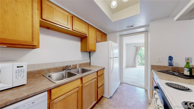 12120 Melody Dr Unit 308, Westminster, CO 80234 - kitchen featuring a sink, white appliances, and light countertops