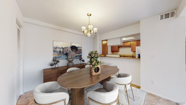 12120 Melody Dr Unit 308, Westminster, CO 80234 - dining room featuring a chandelier and baseboards