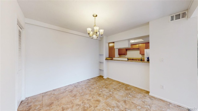 12120 Melody Dr Unit 308, Westminster, CO 80234 - unfurnished dining area with a chandelier