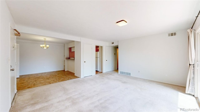 12120 Melody Dr Unit 308, Westminster, CO 80234 - spare room with a chandelier and light carpet
