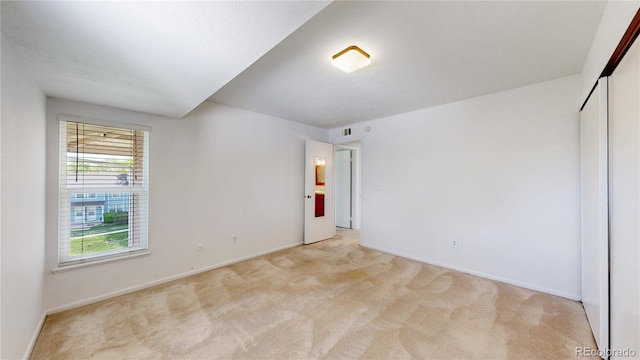 12120 Melody Dr Unit 308, Westminster, CO 80234 - unfurnished bedroom featuring light carpet and baseboards