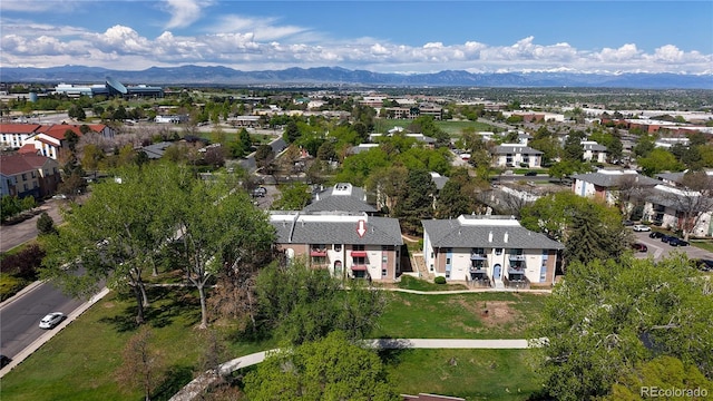 12120 Melody Dr Unit 308, Westminster, CO 80234 - aerial view of property's location featuring a mountain backdrop and nearby suburban area