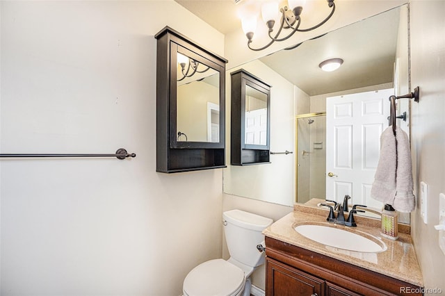 bathroom with a notable chandelier, toilet, a shower, and vanity