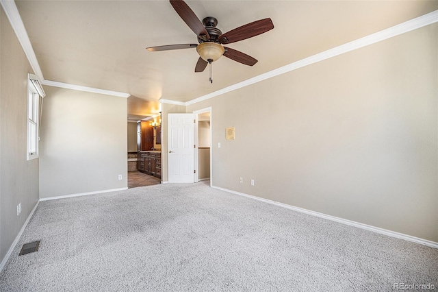 empty room with carpet, ceiling fan, and ornamental molding