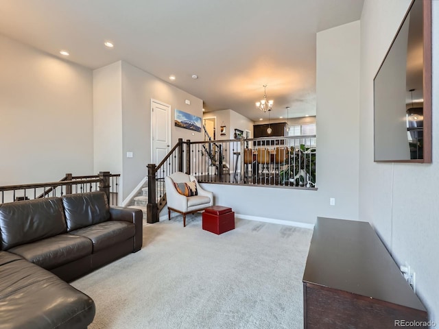 carpeted living room featuring an inviting chandelier