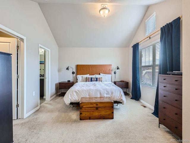 carpeted bedroom featuring lofted ceiling