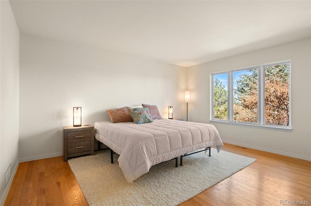 bedroom with light wood-type flooring