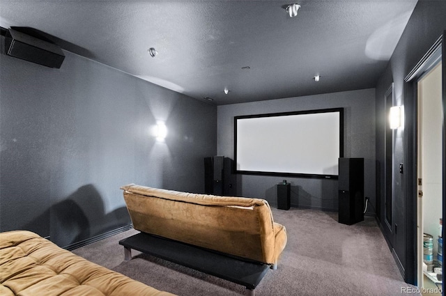 home theater room featuring carpet and a textured ceiling