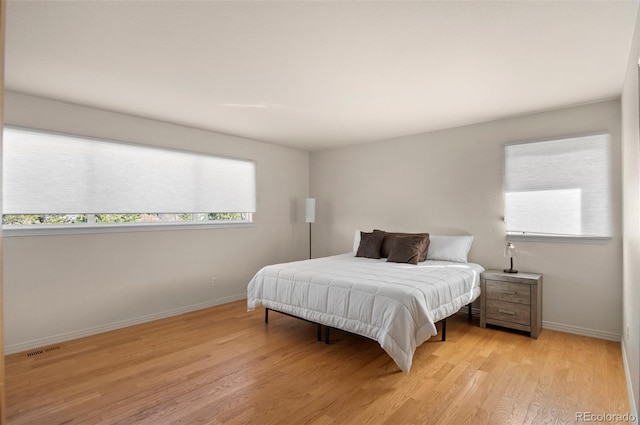 bedroom with light wood-type flooring