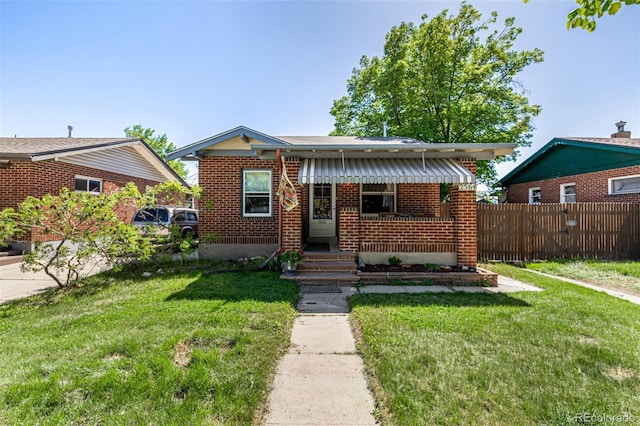 bungalow-style house featuring brick siding