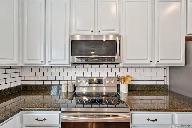 18173 E Saskatoon Pl, Parker, CO 80134 - kitchen featuring appliances with stainless steel finishes, white cabinetry, tasteful backsplash, and dark stone countertops