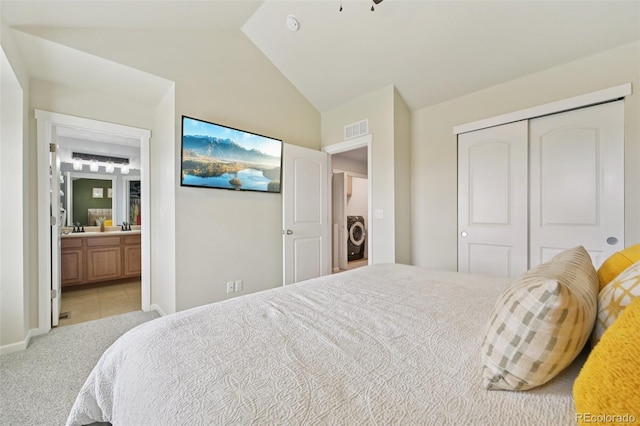 18173 E Saskatoon Pl, Parker, CO 80134 - bedroom featuring light carpet, lofted ceiling, a closet, and connected bathroom