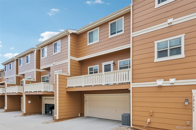 18173 E Saskatoon Pl, Parker, CO 80134 - back of house featuring driveway, an attached garage, and a balcony