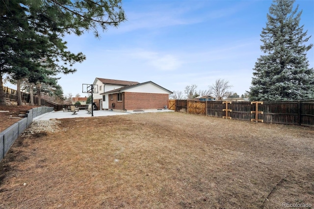 view of yard with a patio and a fenced backyard