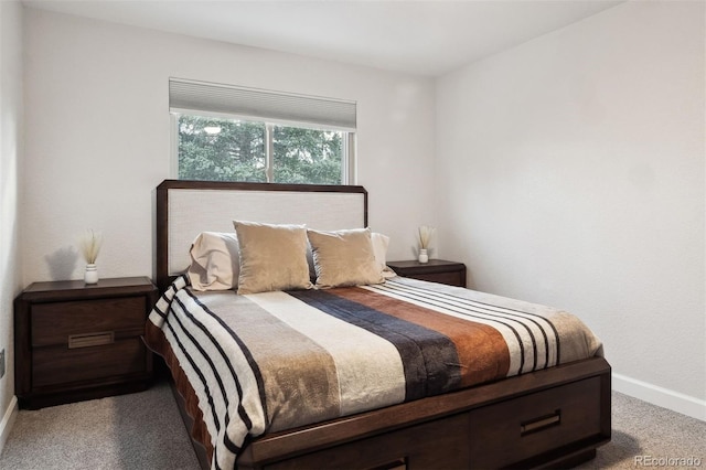 bedroom with carpet flooring and baseboards