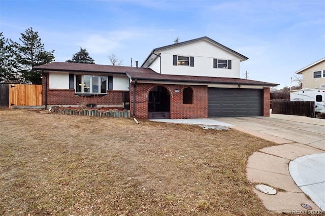 tri-level home featuring concrete driveway, brick siding, fence, and an attached garage