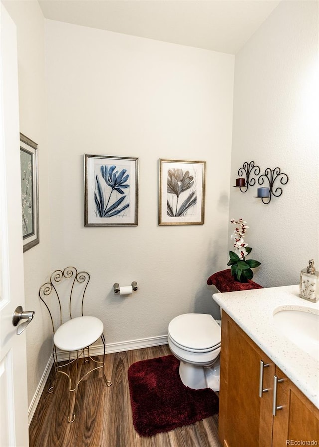 4330 Prairie Agate Dr, Colorado Springs, CO 80938 - half bathroom featuring wood finished floors and vanity