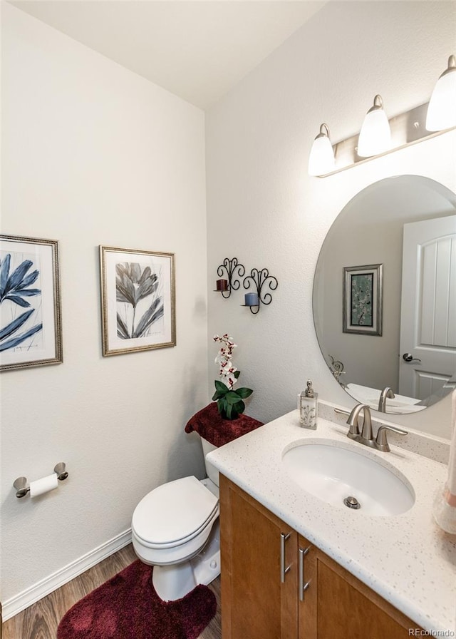 4330 Prairie Agate Dr, Colorado Springs, CO 80938 - half bath featuring vanity and wood finished floors