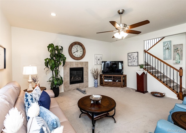 4330 Prairie Agate Dr, Colorado Springs, CO 80938 - living room featuring carpet floors, a ceiling fan, stairway, a tiled fireplace, and recessed lighting