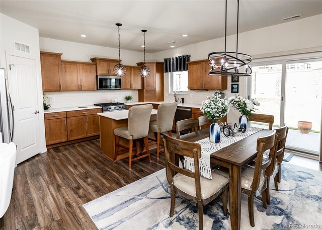 4330 Prairie Agate Dr, Colorado Springs, CO 80938 - dining space with a chandelier, dark wood finished floors, and recessed lighting