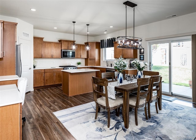 4330 Prairie Agate Dr, Colorado Springs, CO 80938 - dining area with dark wood-type flooring, a chandelier, and recessed lighting