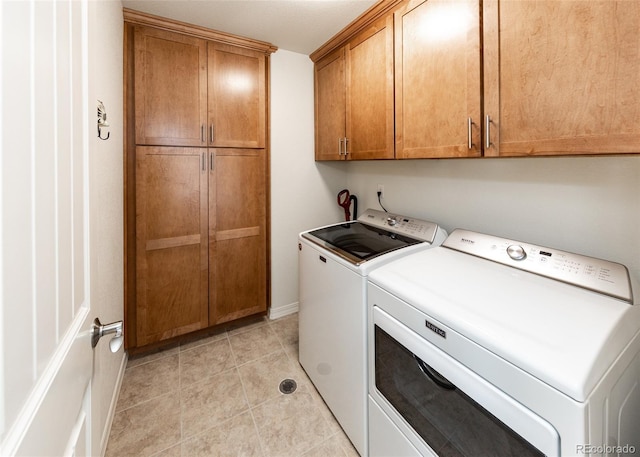 4330 Prairie Agate Dr, Colorado Springs, CO 80938 - laundry area with separate washer and dryer, cabinet space, and light tile patterned floors