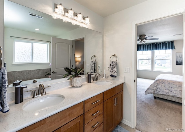 4330 Prairie Agate Dr, Colorado Springs, CO 80938 - bathroom featuring ensuite bathroom, double vanity, a tub, and a ceiling fan
